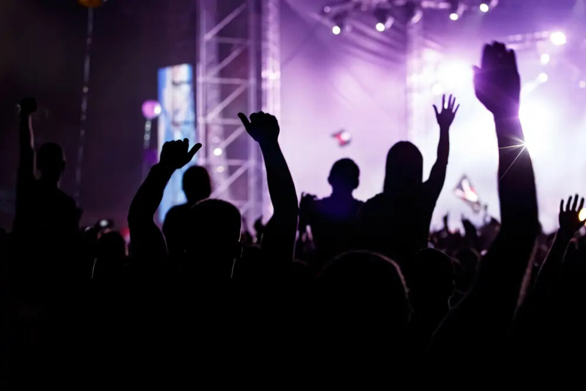 Crowd with raised hands at a concert