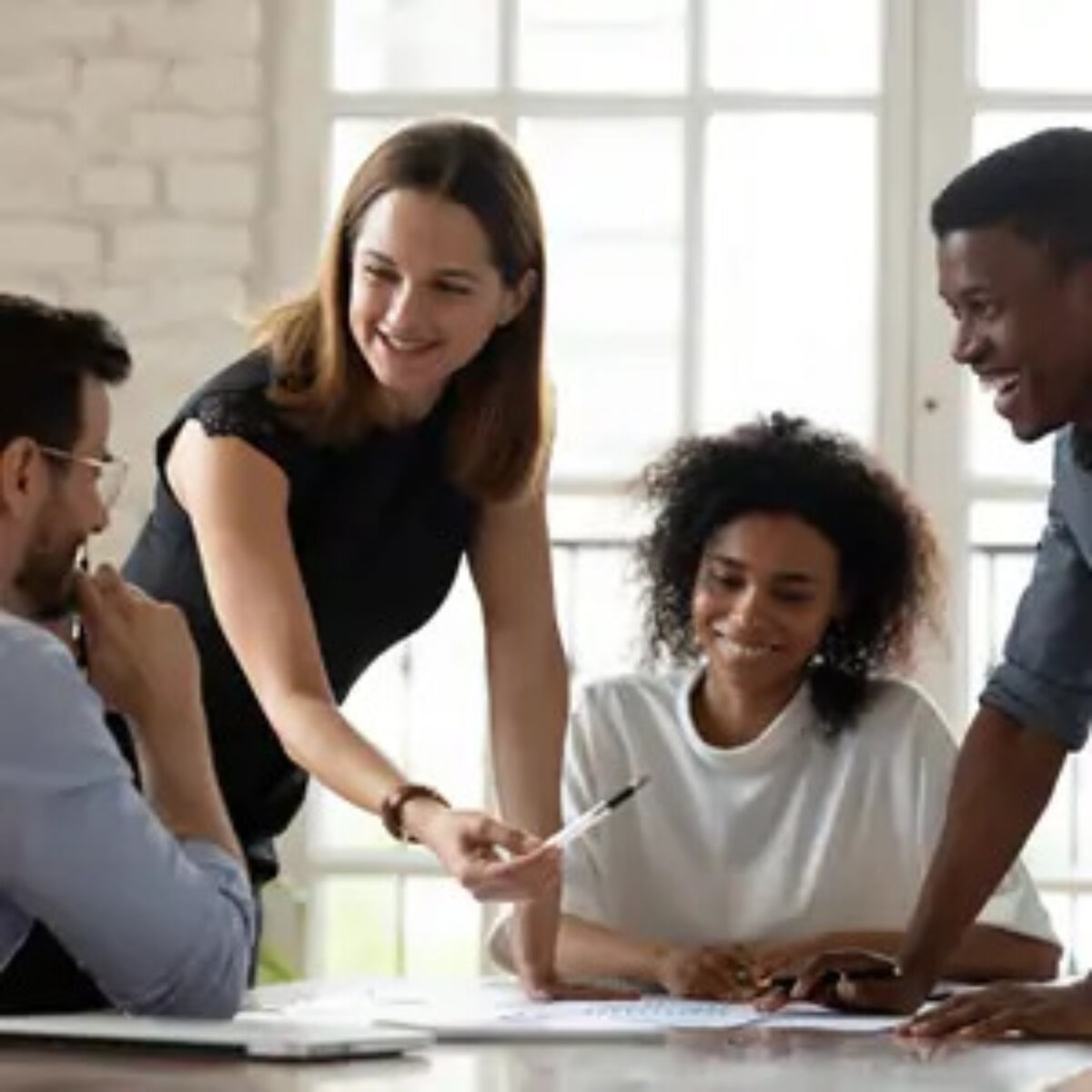 Businesspeople smiling in meeting