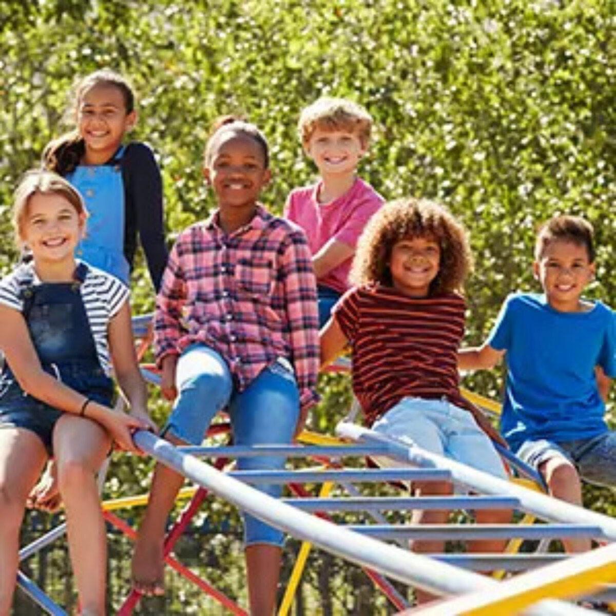 Group of children posing for photo in park