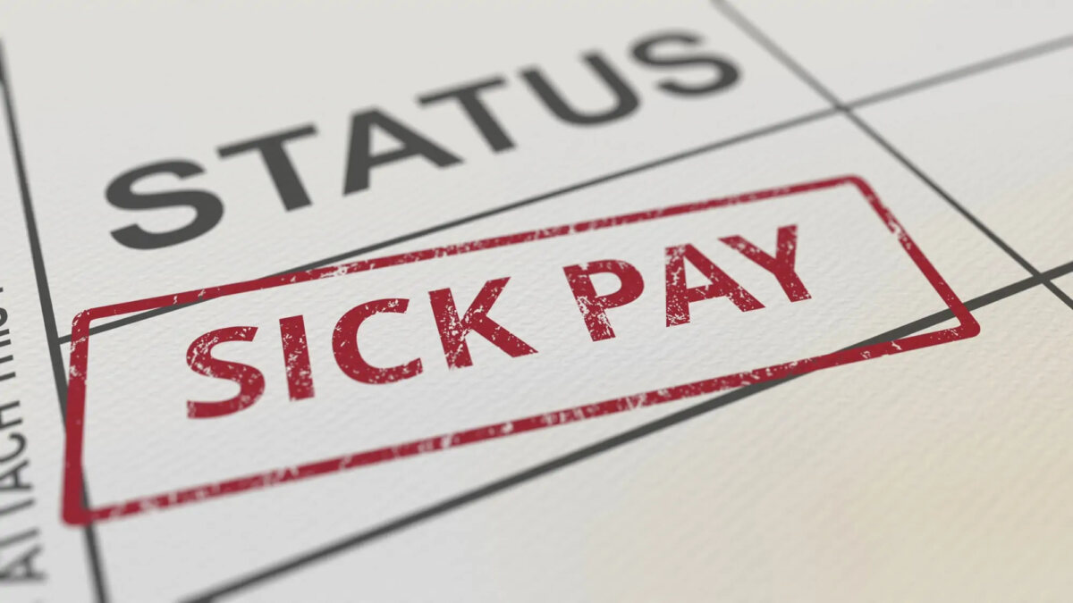 Red sick pay stamp on paper form