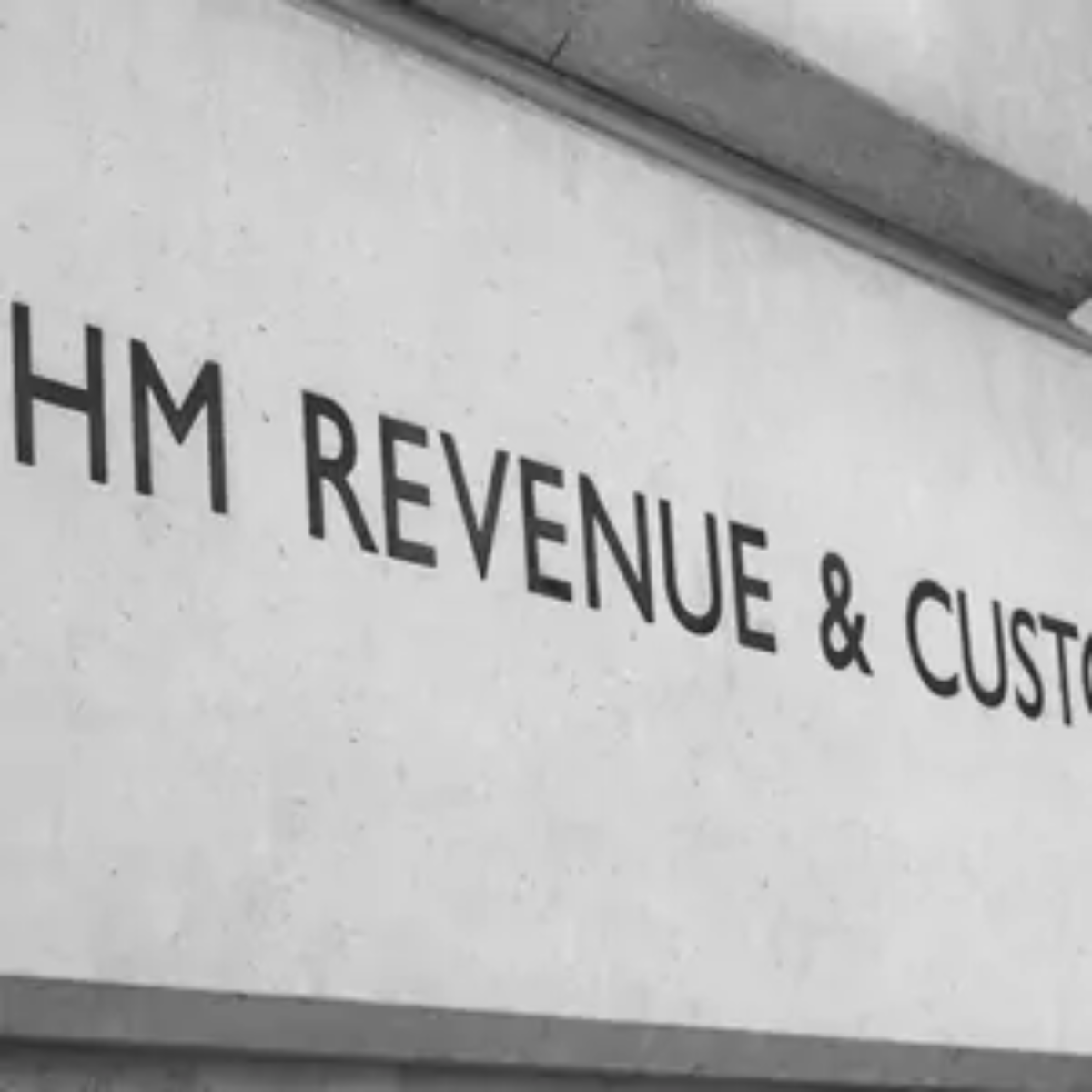 Brick of a building with 'HM REVENUE & CUSTOMS' engraved on it