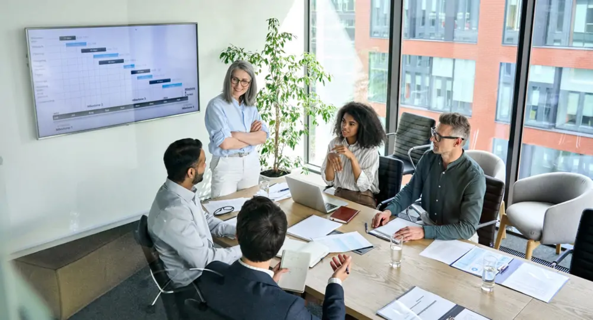 Businesspeople in a meeting discussing business success