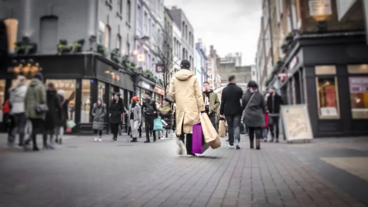 Blurred shoppers on street