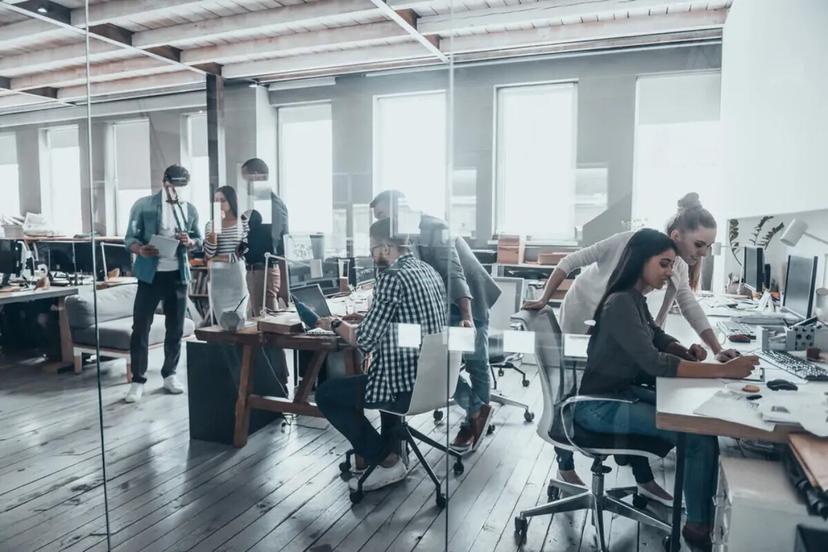 Young people working collaboratively in modern open office