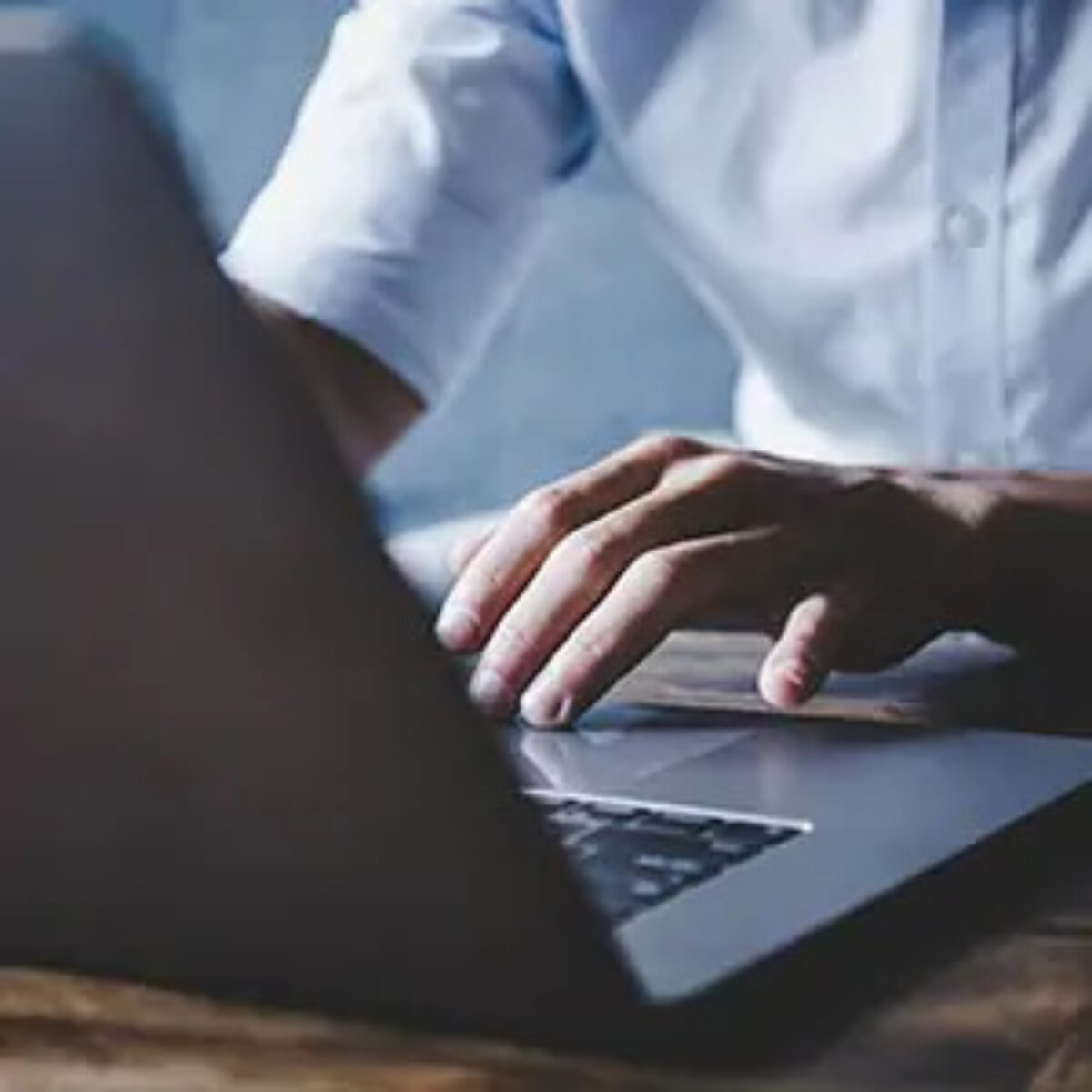 Businessman at desk working on laptop