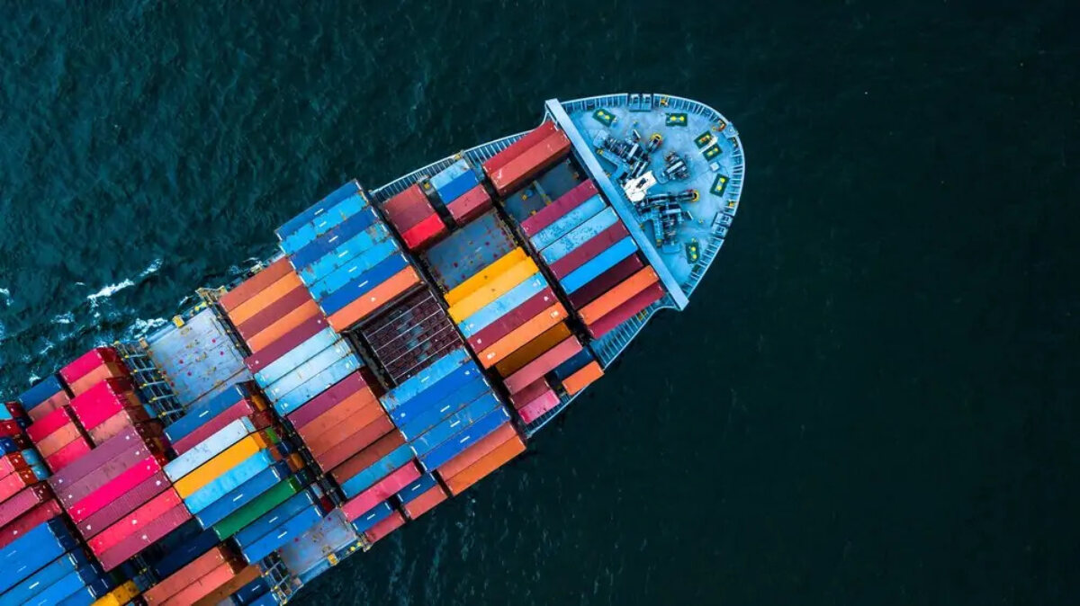 Cargo ship in sea from above
