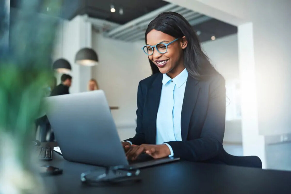 Businesswoman at desk using laptop