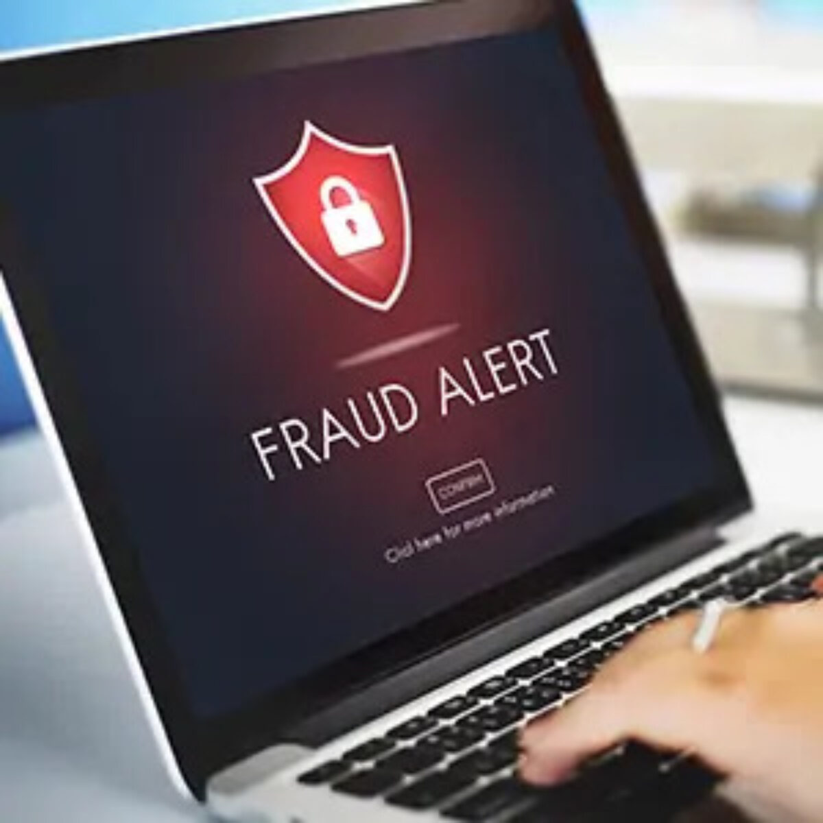 Laptop screen displaying 'fraud alert' warning