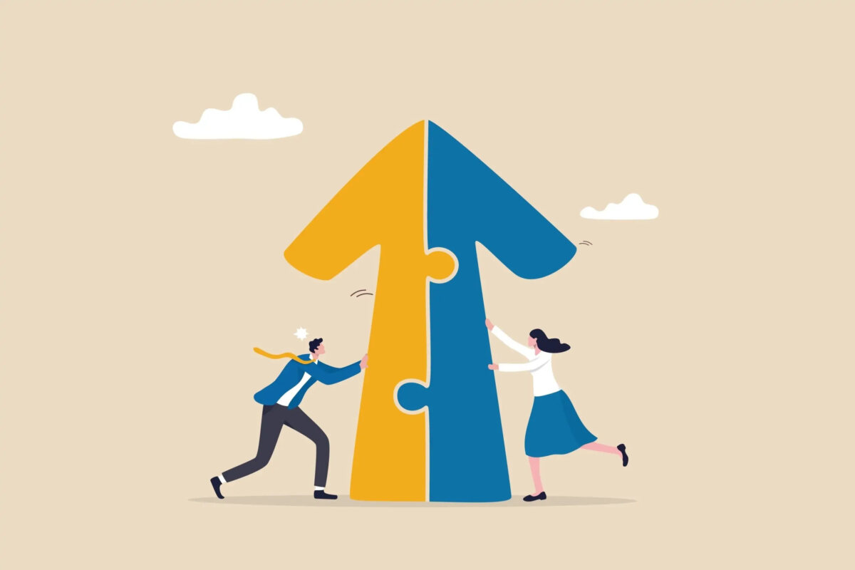 Cartoon of two miniature businesspeople putting together two jigsaw pieces to make an upwards arrow