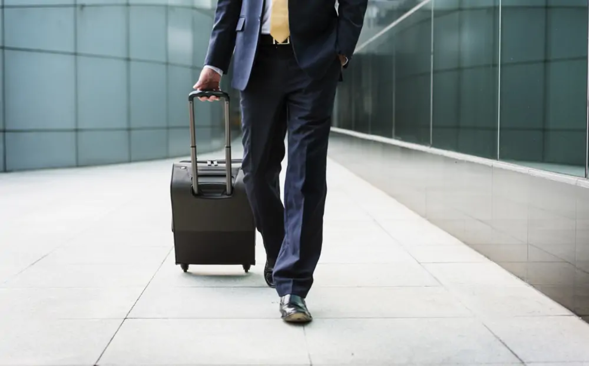 Businessman walking with suitcase