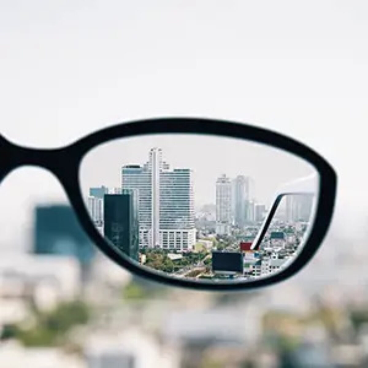 Cityscape views through one lens of a pair of glasses