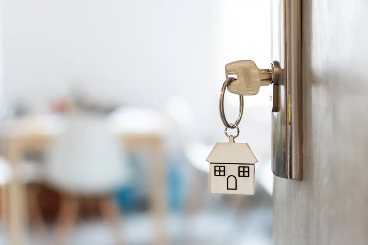 Key in lock with a house keyring attached