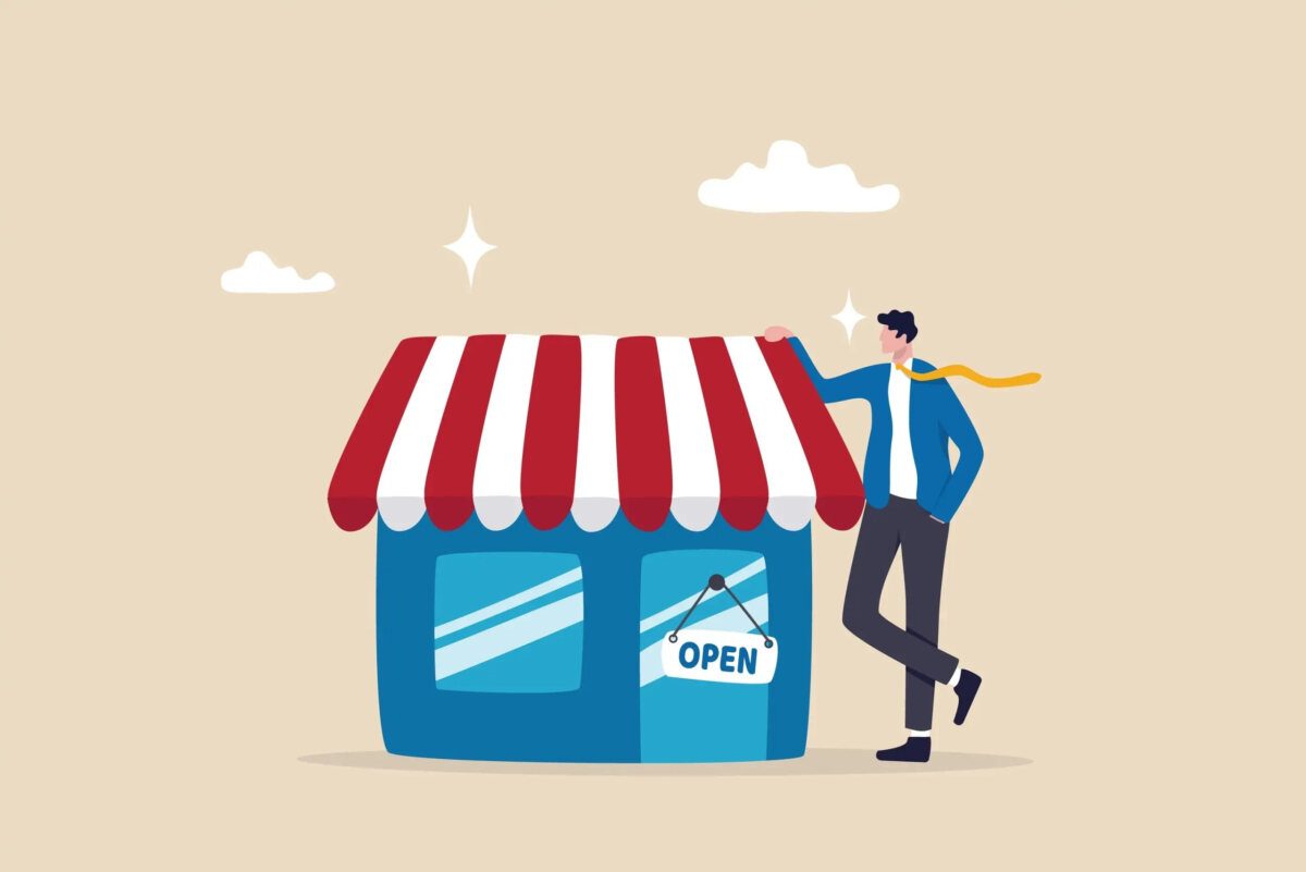 Cartoon of a businessman resting hand on roof of miniature shopfront