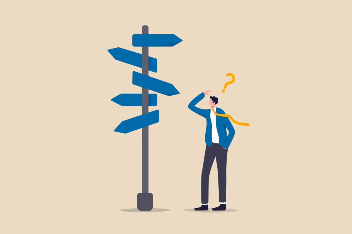 Cartoon of businessman looking at pole with direction signs with question mark above head
