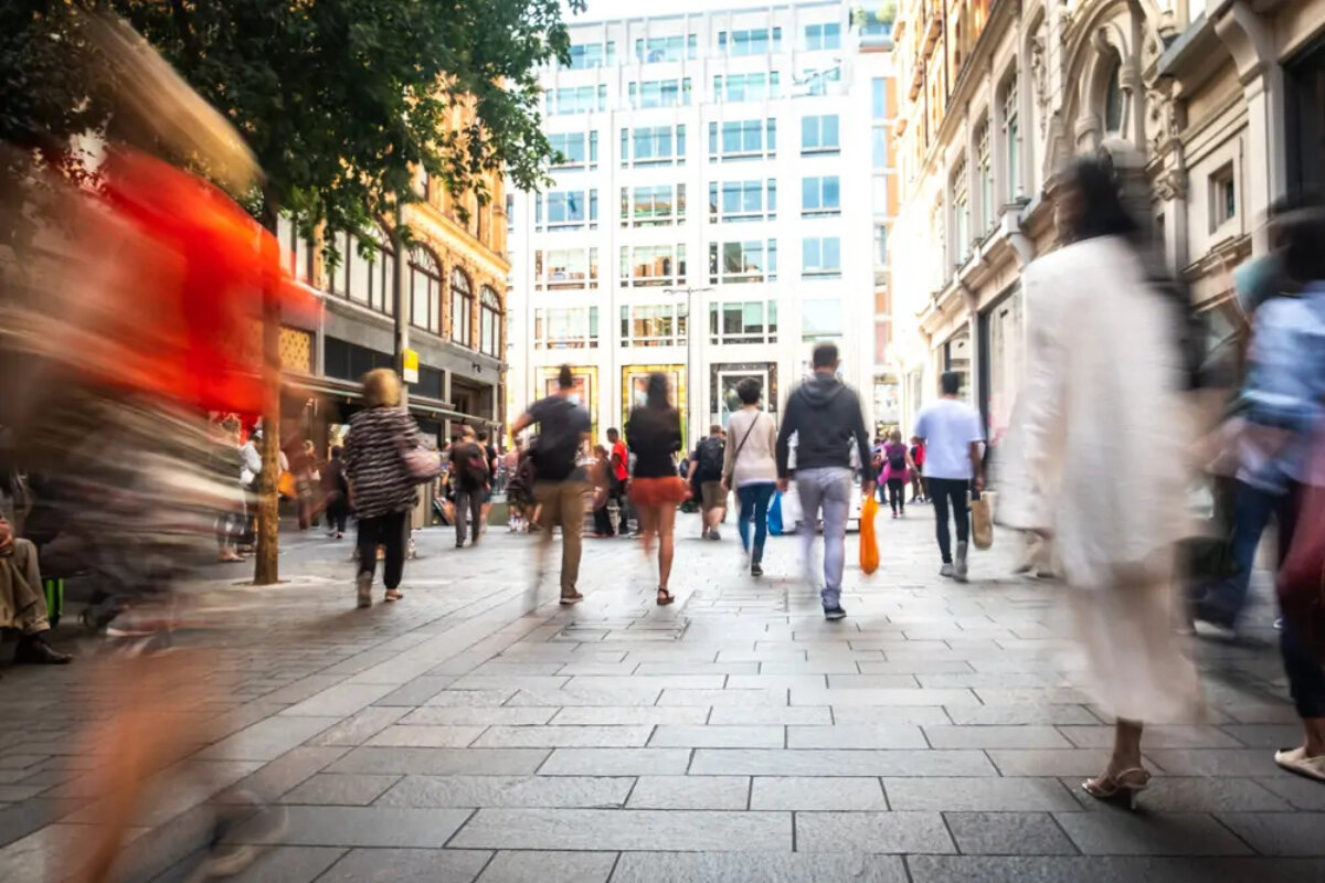 Blurred crowds walking on street