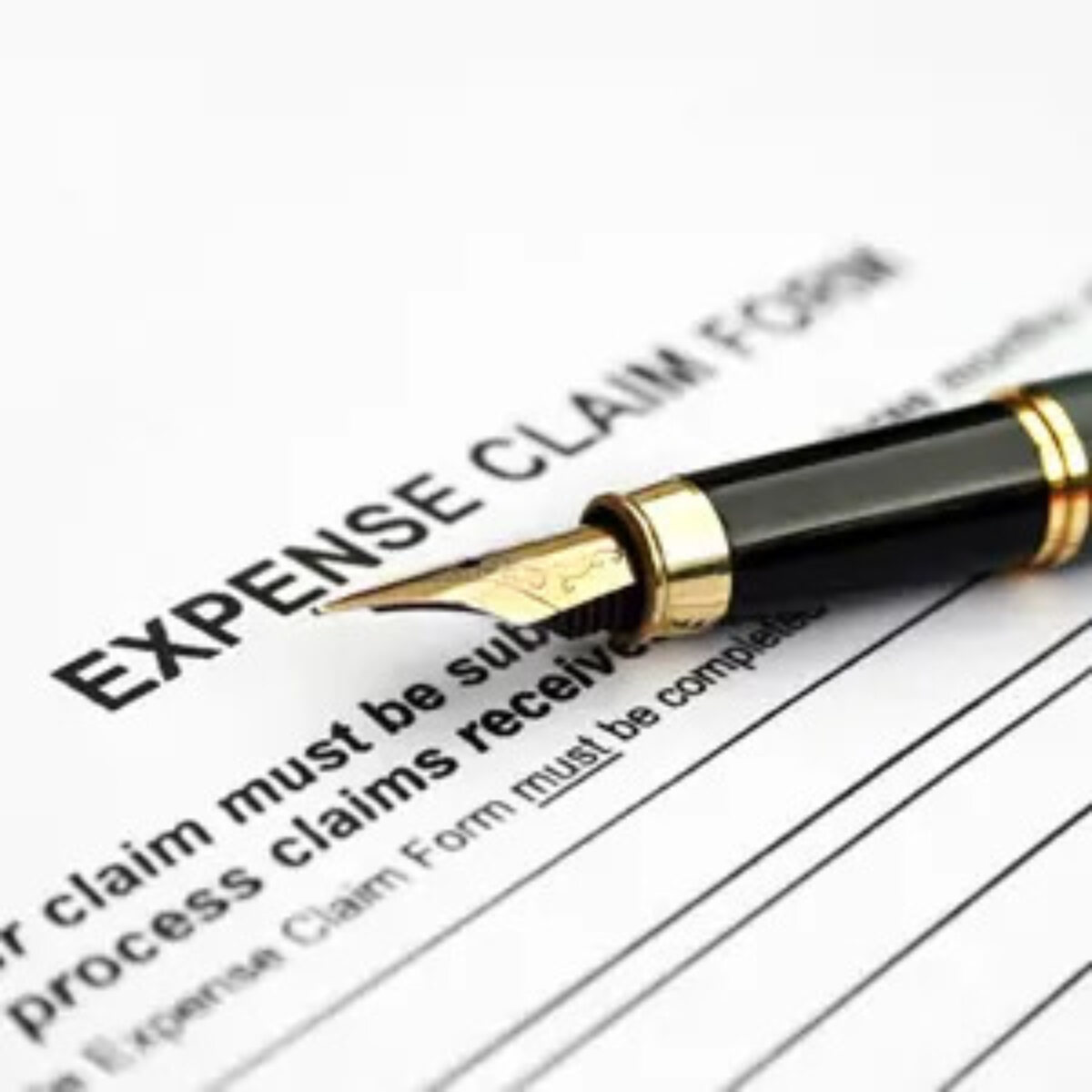Fountain pen on top of expense claim form