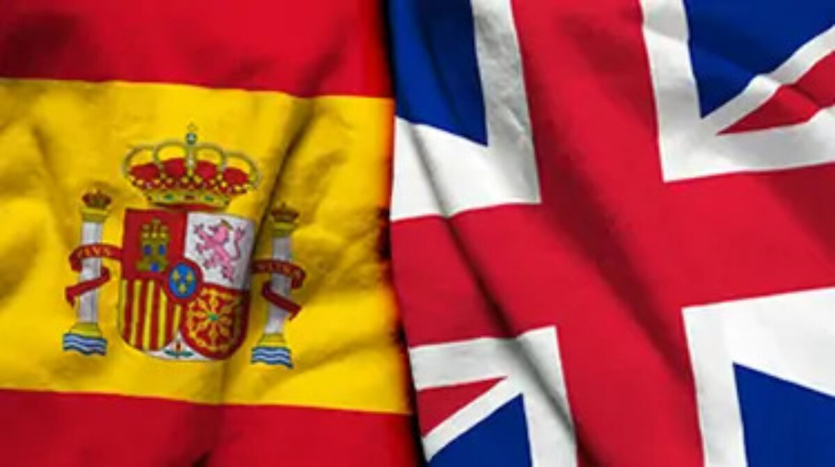 Spanish flag and British flag next to each other
