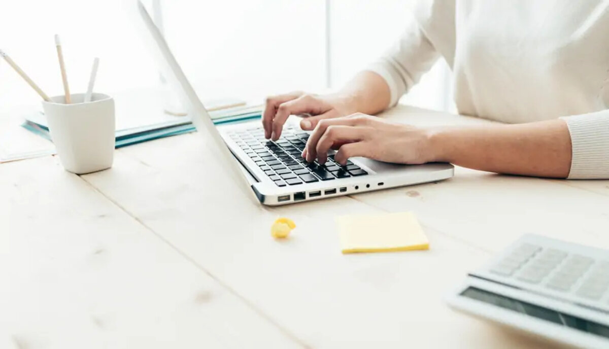Businesswoman working on laptop at desk