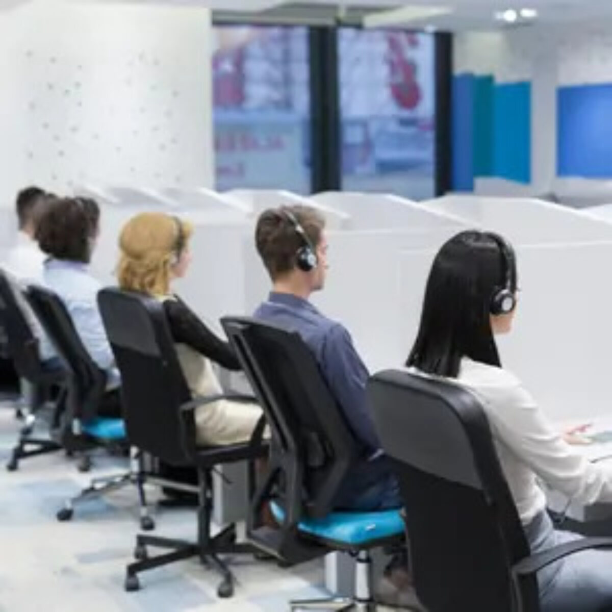 Call centre workers sitting at desks