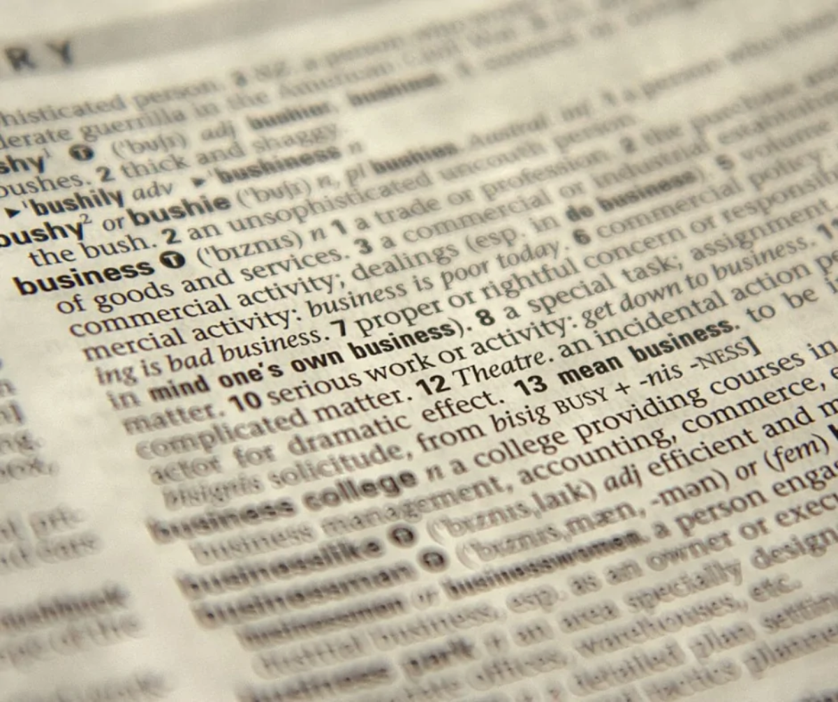 Close-up of dictionary page with definition of the word 'business'