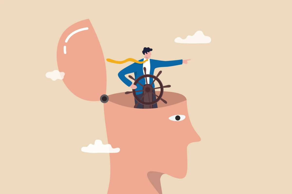 Cartoon of a giant head with the skull wide open on a hinge, with a businessman inside the head steering a ship steering wheel and pointing ahead