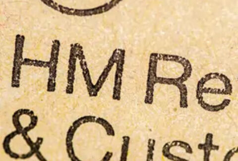 Close-up of an envelope displaying part of the printed 'HM Revenue & Customs'
