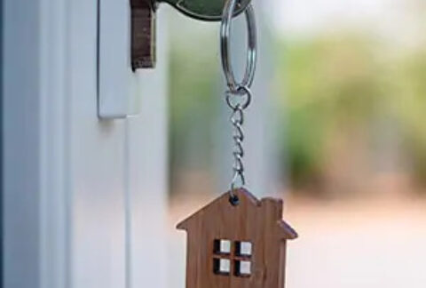 Key in door lock with house keyring attached
