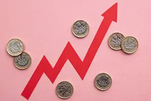 Arrow pointing upwards with pound coins on either side