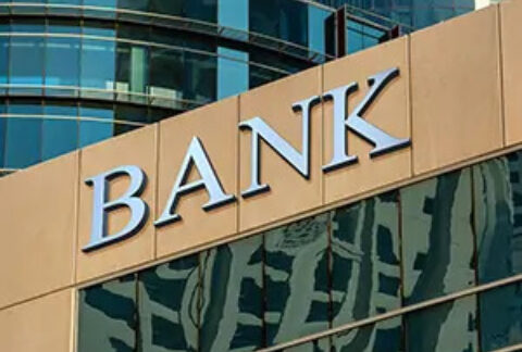'Bank' sign amongst city office buildings