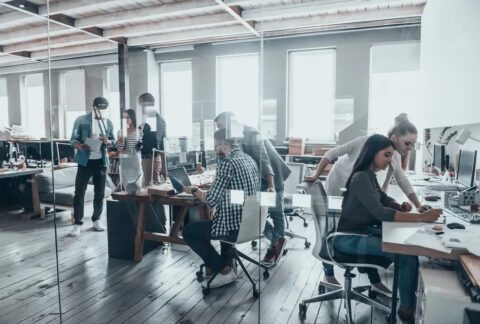 Young people working collaboratively in modern open office