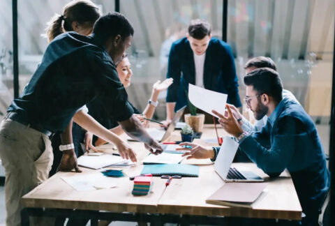 Six businesspeople in a meeting