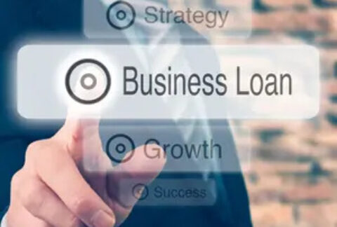 Businessman tapping image of 'business loan' button among other buttons of 'vision', 'strategy', 'growth' and 'success'