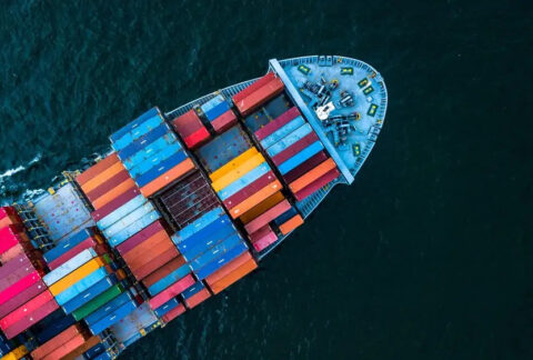 Cargo ship in sea from above