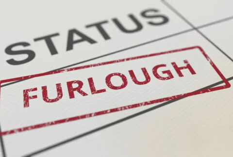 Red furlough stamp on paper form