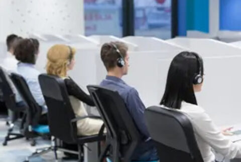 Call centre workers sitting at desks