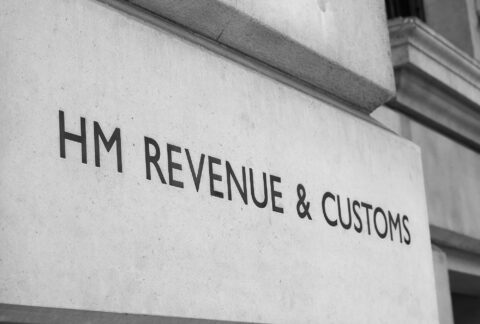 Brick of a building with 'HM REVENUE & CUSTOMS' engraved on it