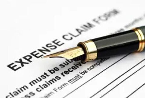 Fountain pen on top of expense claim form