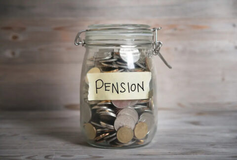 Mason jar full of coins with 'pension' label on front