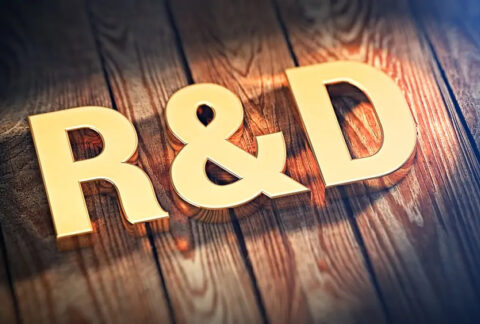 3D R&D in gold letters sitting on wood