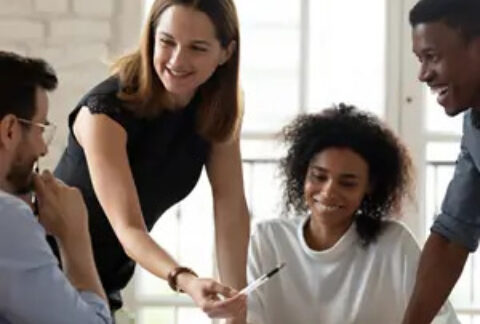 Businesspeople smiling in meeting