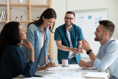 Businesspeople laughing in meeting