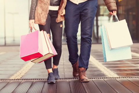 Couple walking with shopping bags