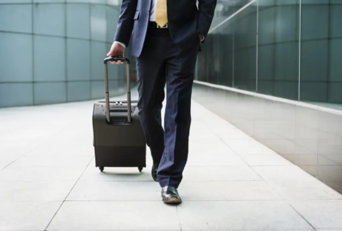 Businessman walking with suitcase