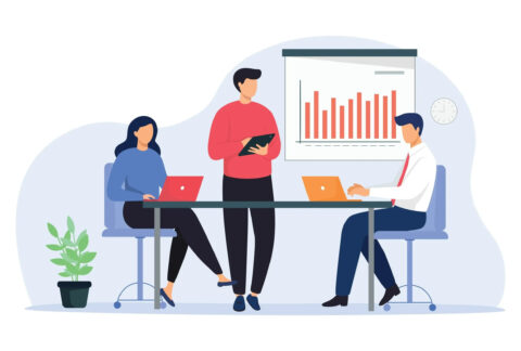 Cartoon of three businesspeople around table in meeting using laptops and tablets with a bar chart on wall behind