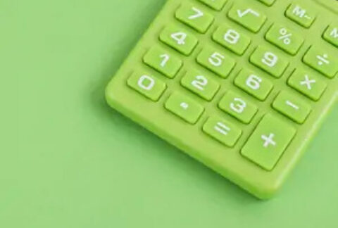 Green calculator keypad on green background