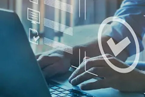 Businessman using laptop overlayed with checkbox and document images