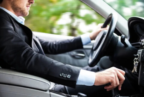 Businessman driving in car