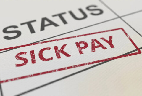 Red sick pay stamp on paper form