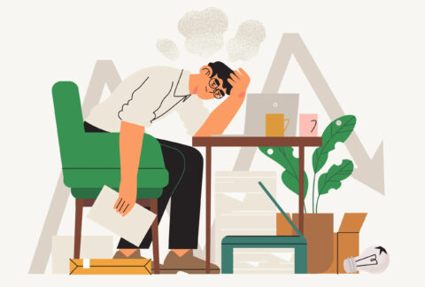 Cartoon of businessman sitting at desk with head in hand and other hand holding a document