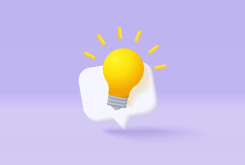 Cartoon of a glowing lightbulb in front of a speech bubble